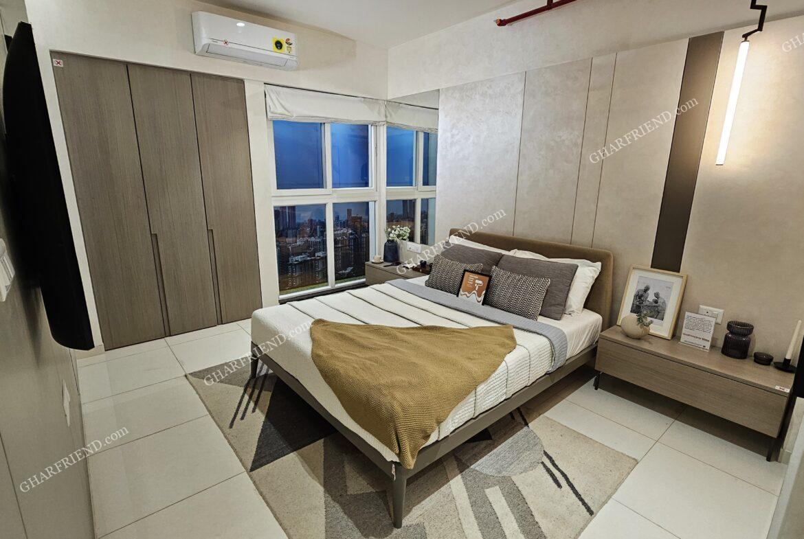 Spacious and elegant bedroom at Mahindra Vista, Kandivali East, featuring modern interiors, ample natural light, and a cozy ambiance
