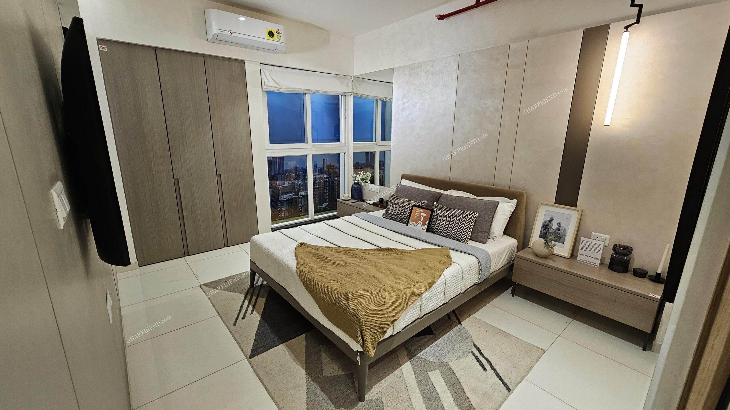 Spacious and elegant bedroom at Mahindra Vista, Kandivali East, featuring modern interiors, ample natural light, and a cozy ambiance