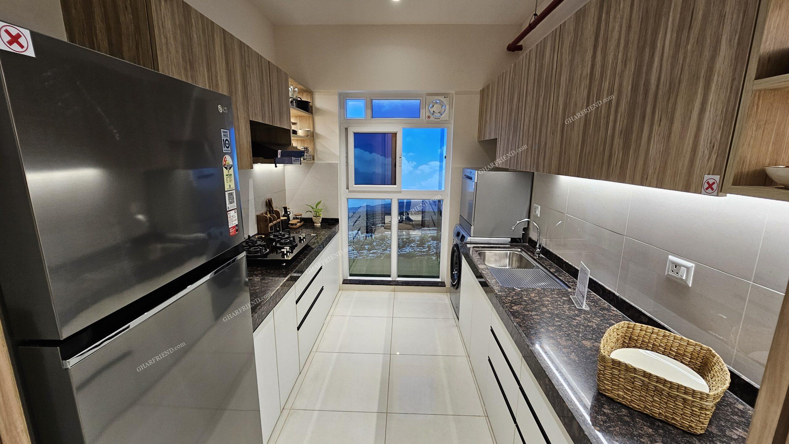 Modern modular kitchen at Mahindra Vista, Kandivali East, featuring premium fittings, ample storage, and a sleek design for an efficient cooking experience