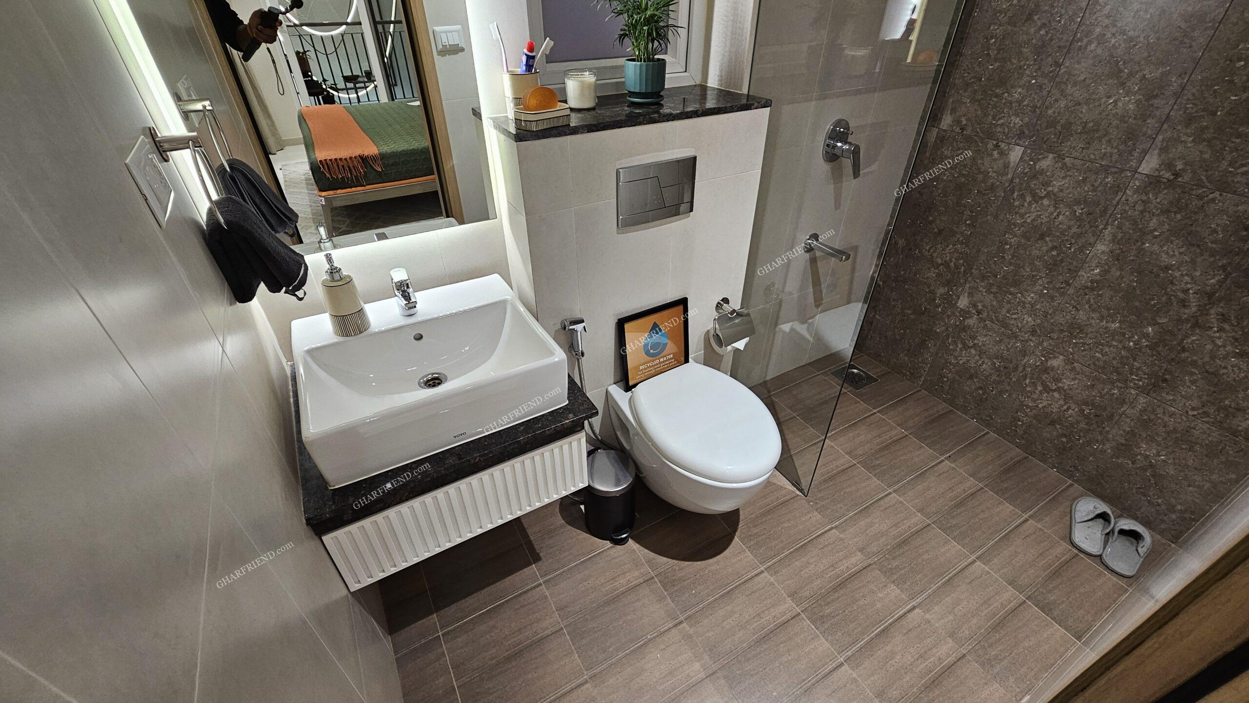 Modern washroom at Mahindra Vista, Kandivali East, featuring sleek sanitary fittings, elegant tiling, and a luxurious shower space