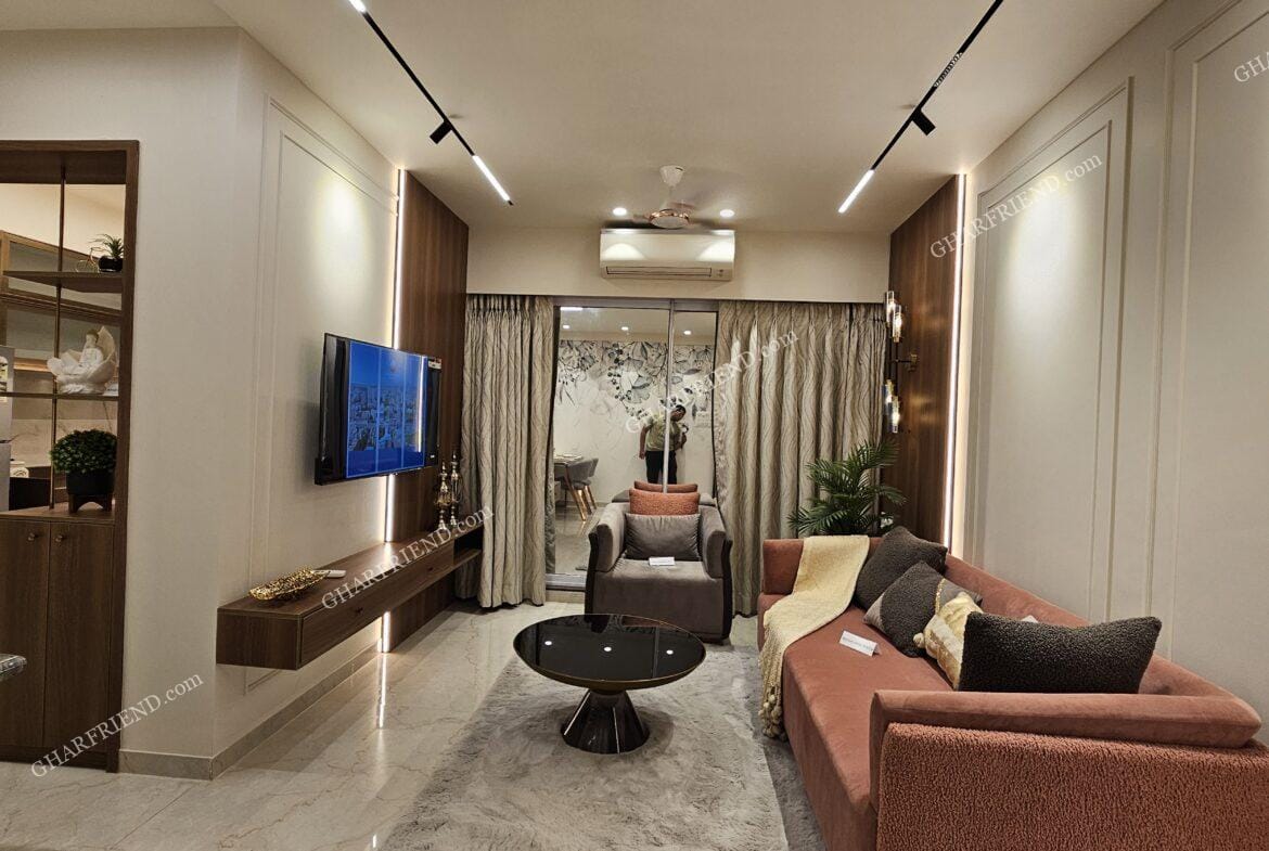 A spacious living room in a 1 & 2 BHK apartment at Mira Road, featuring modern interiors, ample lighting, and a stylish layout for a comfortable living experience.