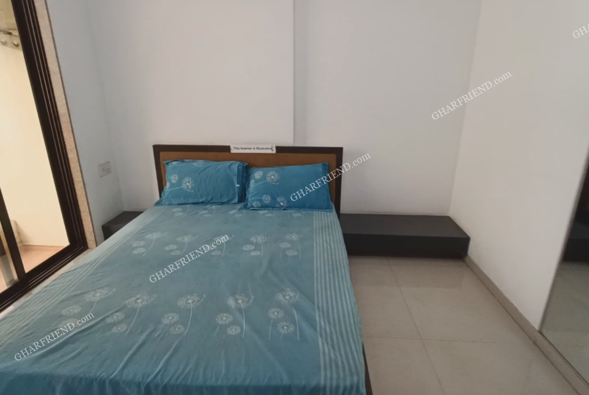 Spacious and well-lit bedroom in a 1BHK apartment for rent at Tiara Hill, Mira Road, featuring modern interiors and ample space.