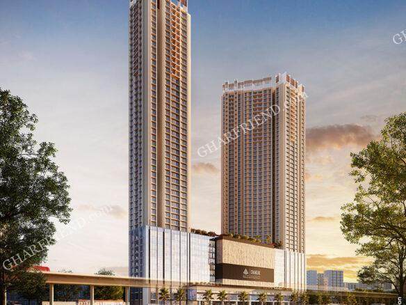 A modern high-rise residential building at Green Airy by Chandak Group in Borivali, surrounded by lush greenery and landscaped gardens, offering a serene and luxurious living environment.