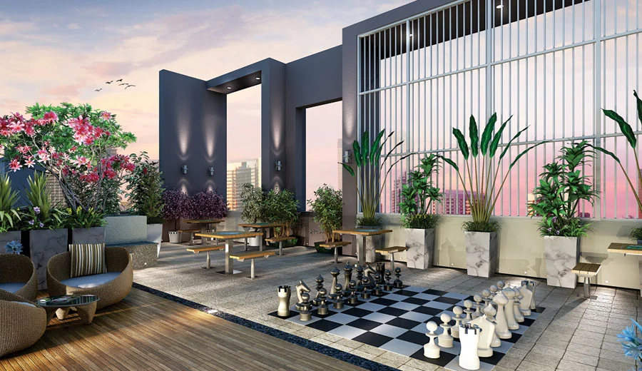 Relax & Strategize – Seating Area with Chess Court at Northern Hills A well-designed seating area at Northern Hills with an open-air chess court, offering a peaceful retreat for relaxation and mental stimulation.