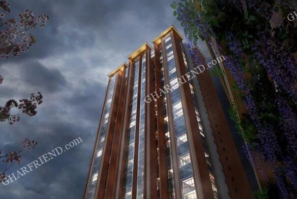 A luxurious high-rise residential building of Ruparel Stardom in Malad West, surrounded by lush greenery and modern infrastructure, showcasing elegant architectural design.