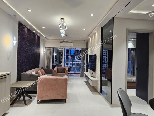 Spacious and elegantly designed living room in a luxurious 1 & 2 BHK apartment at Kandivali West, featuring modern interiors and premium furnishings.